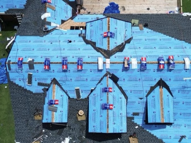 Aerial view of a large GAF roof replacement in progress
