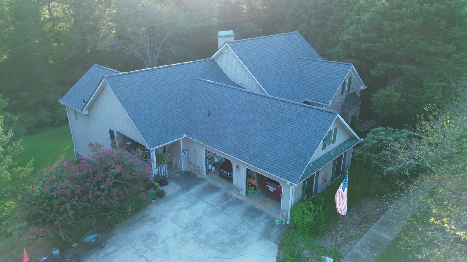 Completed shingle roof on a ranch home with attached garage