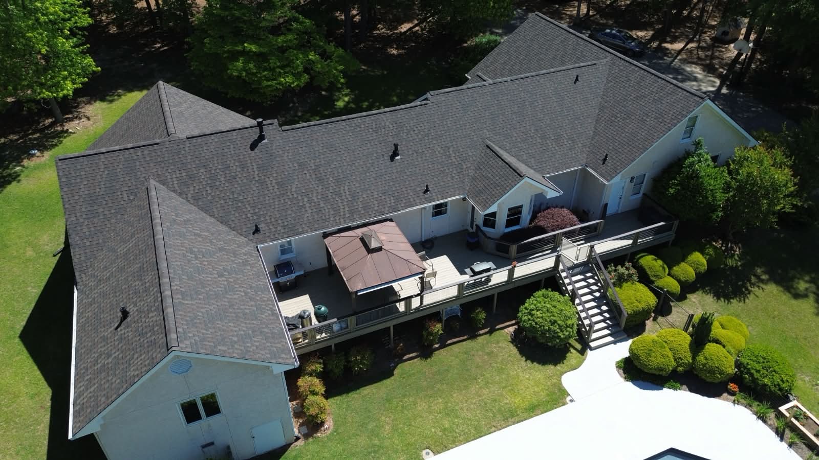 Rear elevation of a two-story home after roof replacement